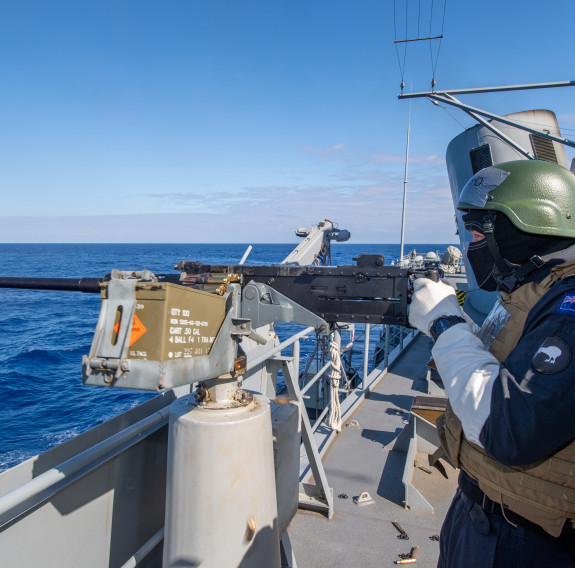 Sailors on HMNZS Te Mana conduct firing practice at sea