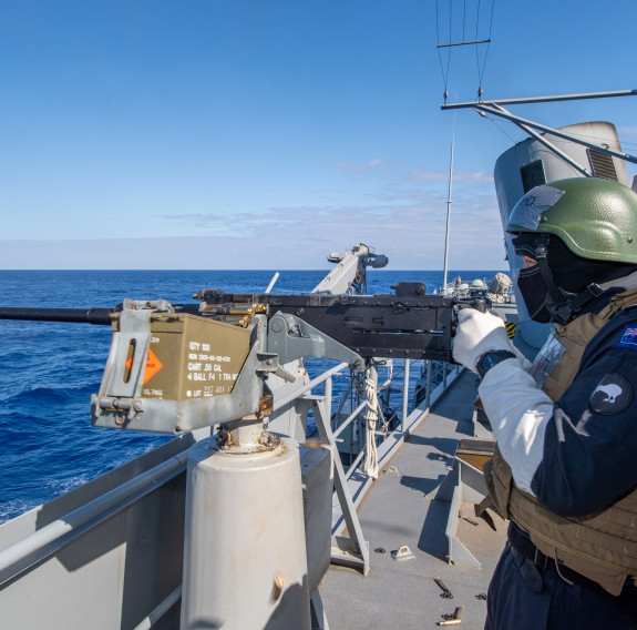 Sailors on HMNZS Te Mana conduct firing practice at sea