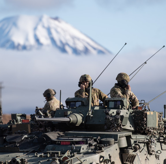 Soldiers from Queen Alexandra's Mounted Rifles on a New Zealand Light Armoured Vehicle (NZLAV)