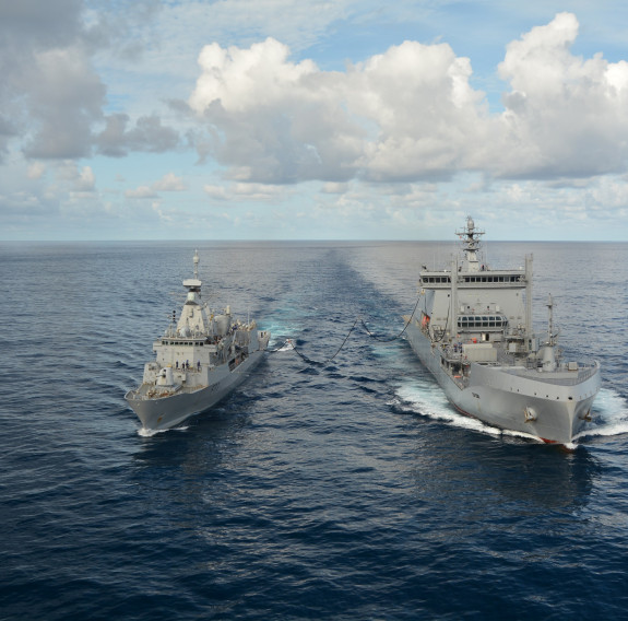 HMNZS Te Kaha and HMNZS Aotearoa performing a Replenishment at Sea (RAS)