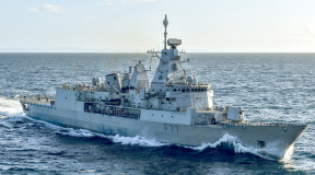 HMNZS Te Kaha sails on the ocean on a sunny day